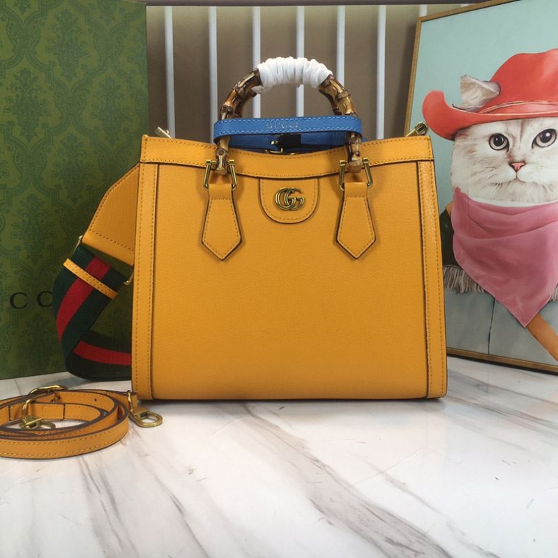 G*u*i top handle bags